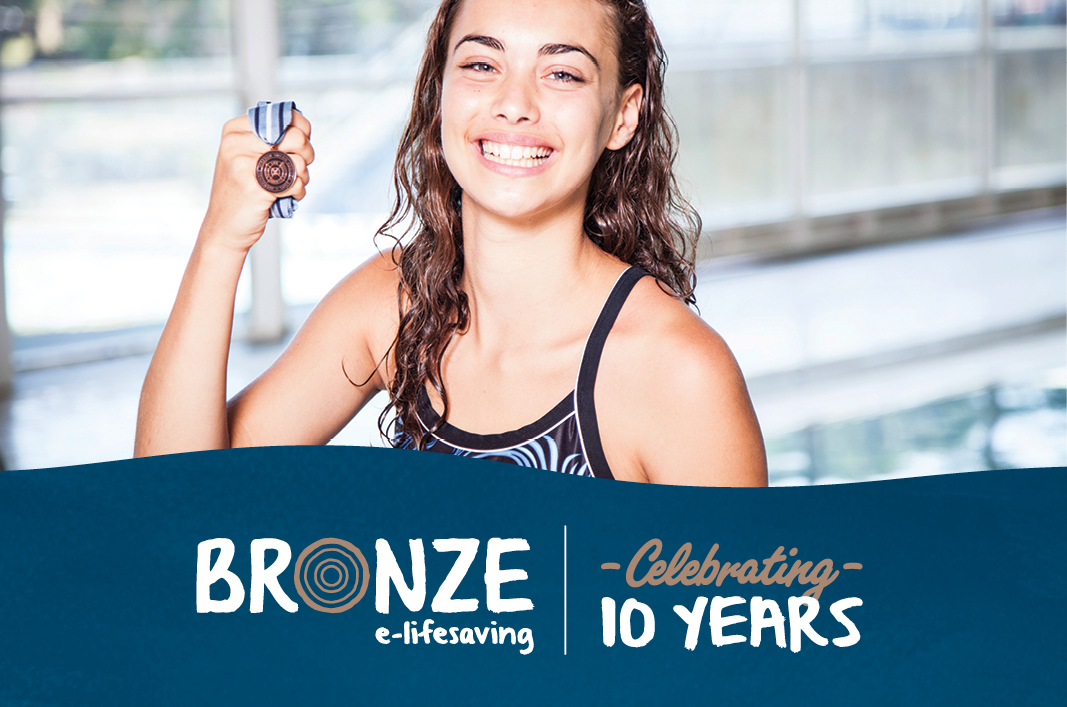 Girl with Bronze Medallion celebrating 10 years of the E Learning program