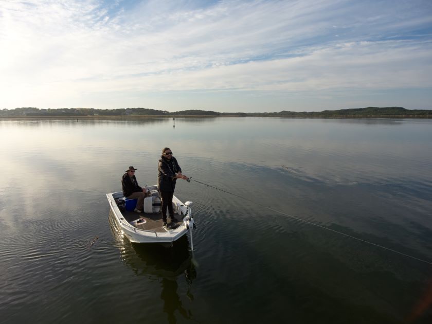 Men Fishing by the River