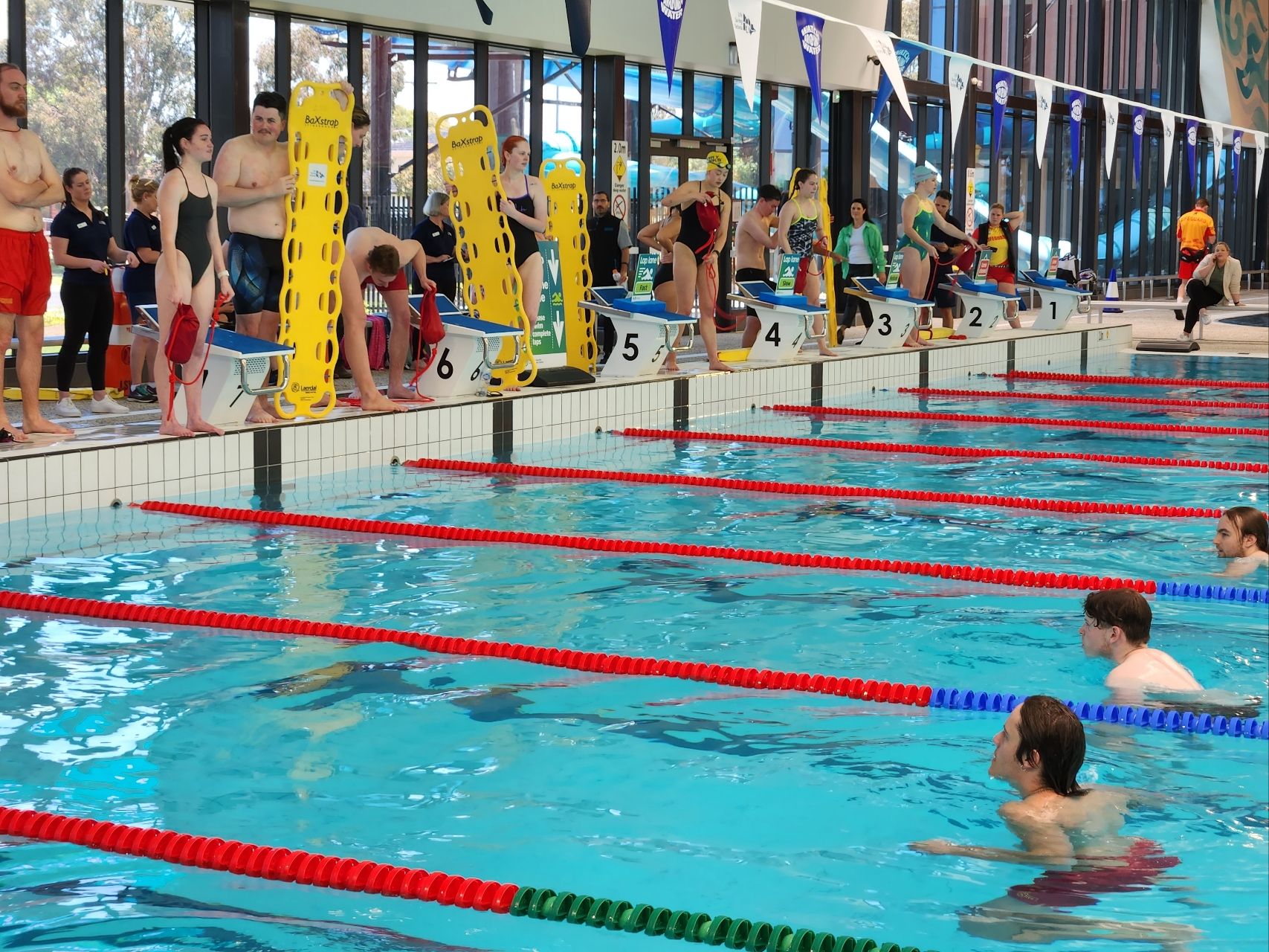 Competitors perform rescues in the pool